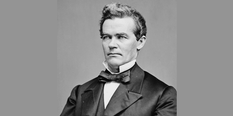 Photo of Conness as a young man in suit and bow tie.