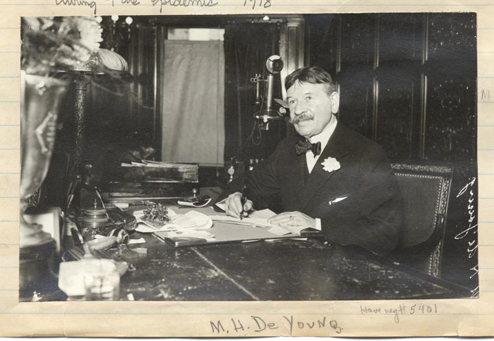 Michael H. De Young at desk writing