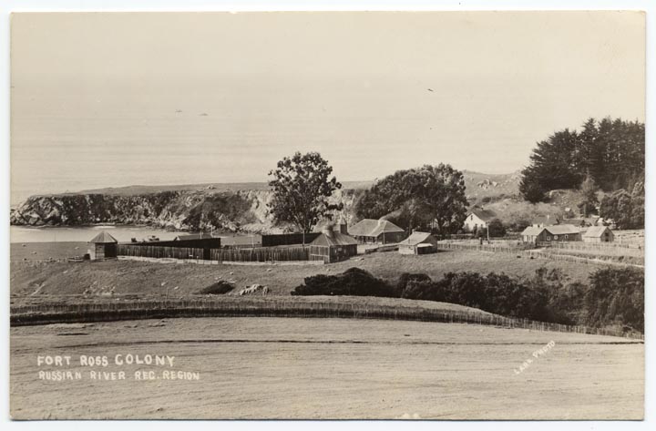 View of Fort Ross with trees and the ocean in the background