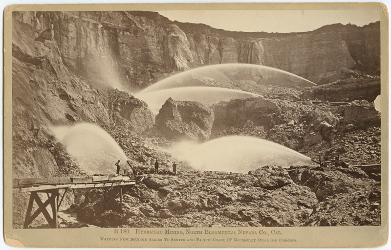 Shows monitors sluicing hillsides, flume in foregrond, several men standing in foreground. "Watkins' New Boudoir Series".