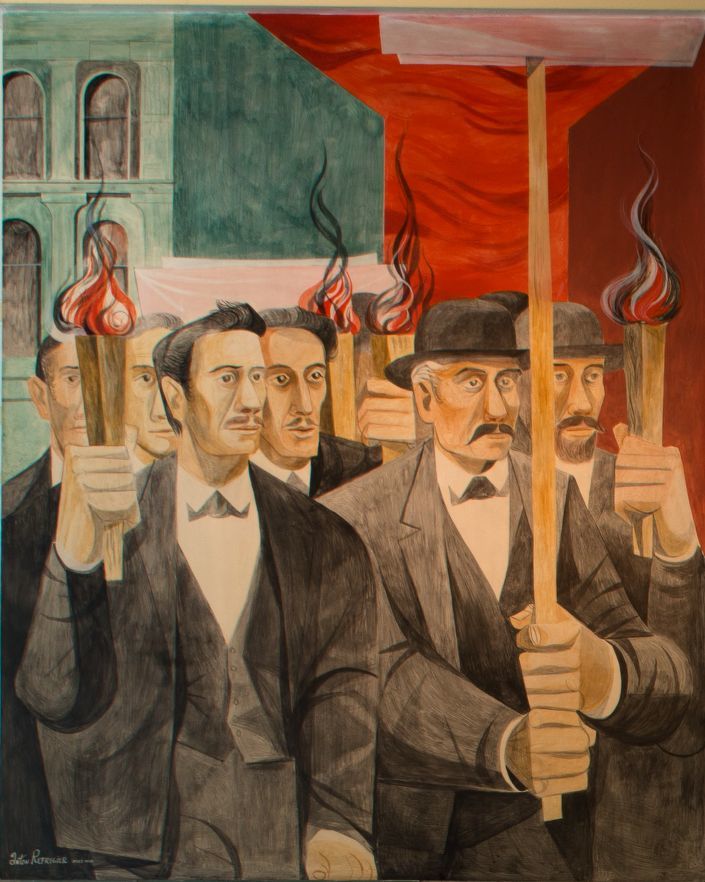 Men in suits and ties carry lighted torches in front of city buildings and one man carries a wooden picket sign post but the sign is not visible.